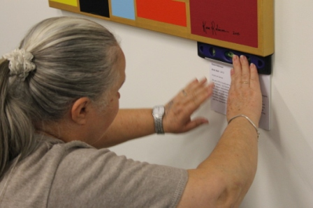 No. 26 - 'When words are hard to find' Solo Exhibition of Karen Robinson 6.5.15 Karen placing art work text art at Gee Lee-Wik Doleen Gallery for Exhibition.JPG
