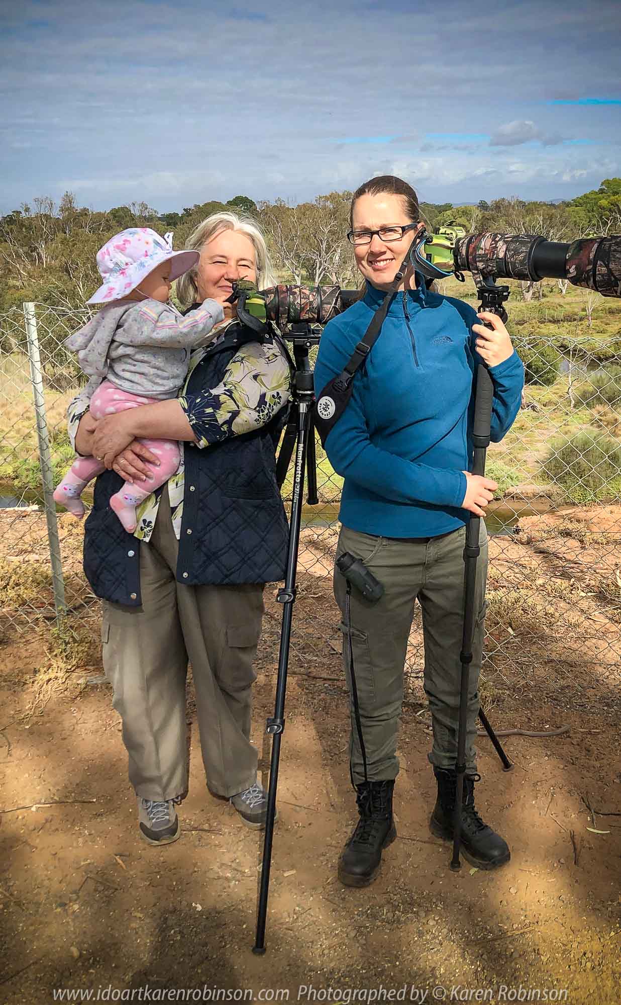 Werribee South, Victoria - Australia 'Werribee River K Road' Photograph by Karen Robinson February 2019 Comments - A morning out with hubby and me with granddaughter and daughter photographing rare sighting of an Eastern Osprey water bird. Photograph featuring Karen Robinson holding granddaughter standing next to daughter.