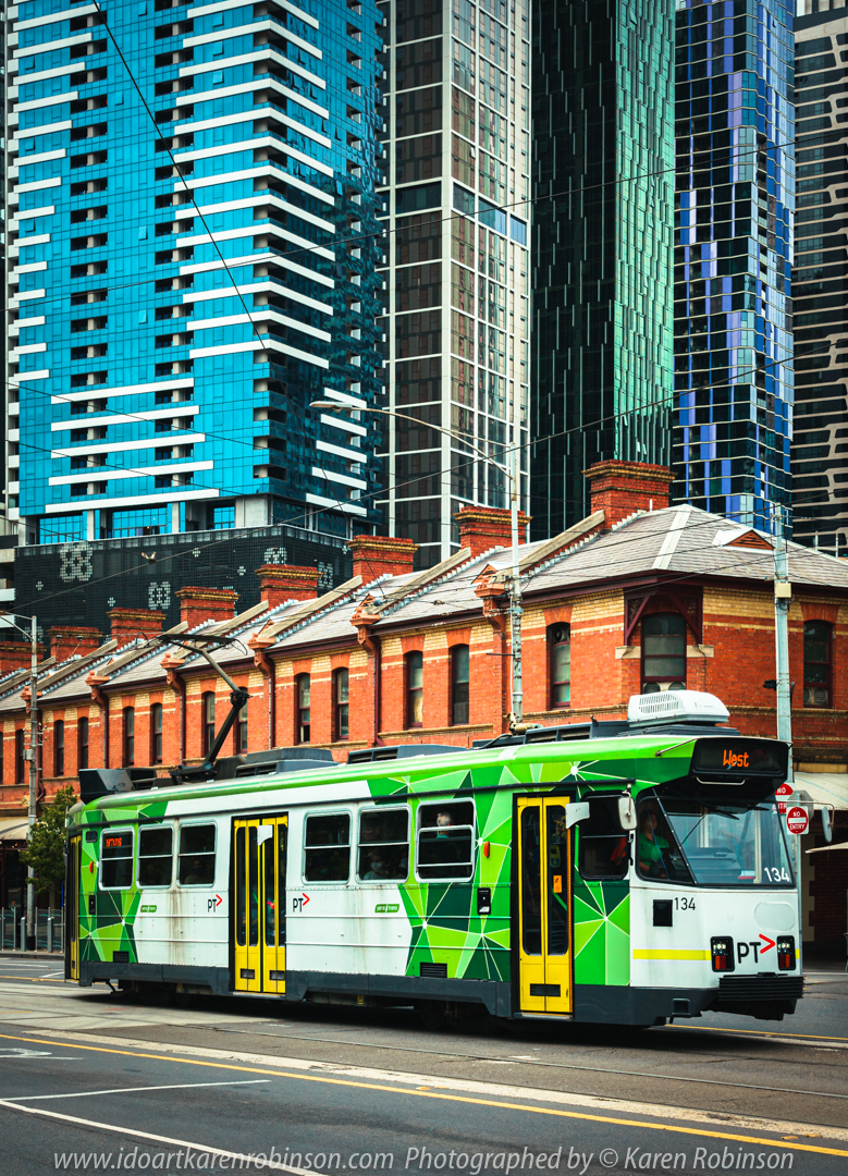 West Melbourne, Victoria - Australia 'Victoria Street - Queen Victoria Market' Photographed by Karen Robinson February 2021 Comments: Out-and-about doing some more Street/Documentary Photography. In this image, I managed to capture patterned, beautifully coloured skyscrapers behind a line of Queen Victoria Market orange brick buildings with one of Melbourne's Trams travelling through the scene in the foreground. Great contrasts of colour and patterns!