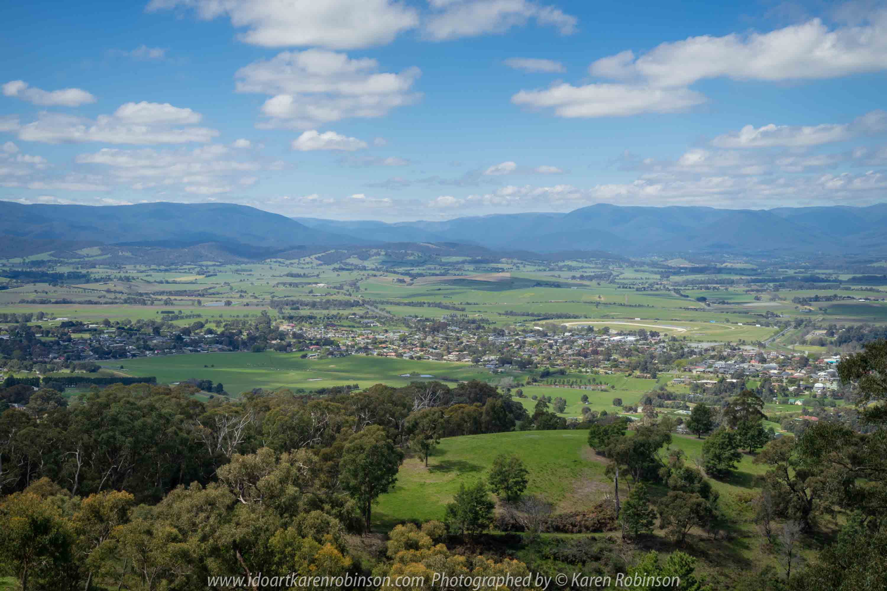 Comments: Yarra Glen Region, Victoria - Australia September 2018. The last day in September, a beautiful spring day, hubby and I decided to take a drive through the Yarra Glen Region. At this time of the year the valleys and hillsides are lush green. Vineyards feature widely throughout the region alongside of pastures where cattle happily grazed under the warm sunshine. Grey clouds gathered up along the mountains ranges as the day drifted towards its end. A beautiful spring day we so much enjoyed – a good to be alive day! NB: All images are protected by copyright laws Photographed by Karen Robinson www.idoartkarenrobinson.com